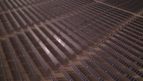 aerial-of-solar-panel-photovoltaic-farm-plant-during-a-sunny-day-alternative-electricity-supply-production-in-Joshua-Tree-national-park-California-usa