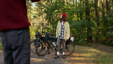 couple on bikes in a forest