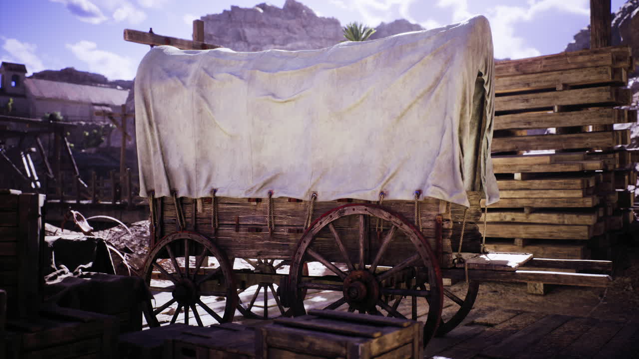 Historic wooden wagon covered with cloth in an old western setting