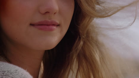 close-up-portrait-beautiful-woman-smiling-enjoying-beach-relaxing-on-seaside-wind-blowing-hair-exploring-peaceful-carefree-lifestyle