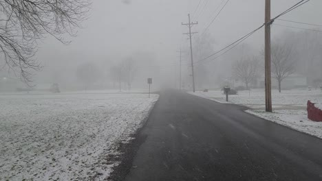 car driving on a road covered with snow