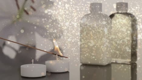 animación de puntos de luz sobre velas y cosméticos