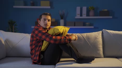 man looking at camera with cowardly eyes.