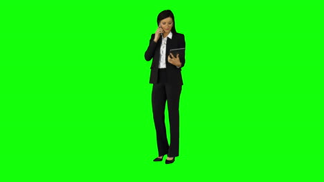 Businesswoman-having-phone-call-on-green-screen-