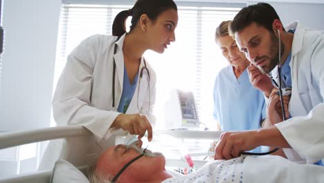 female doctor examining senior woman