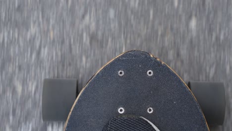 longboard skating pov on newly laid asphalt road