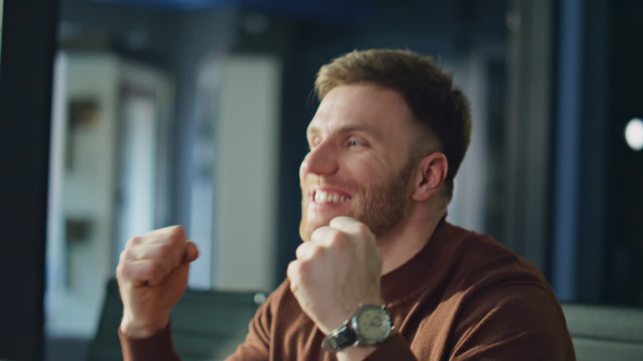 Hardworking professional rejoicing achievement looking phone at office closeup