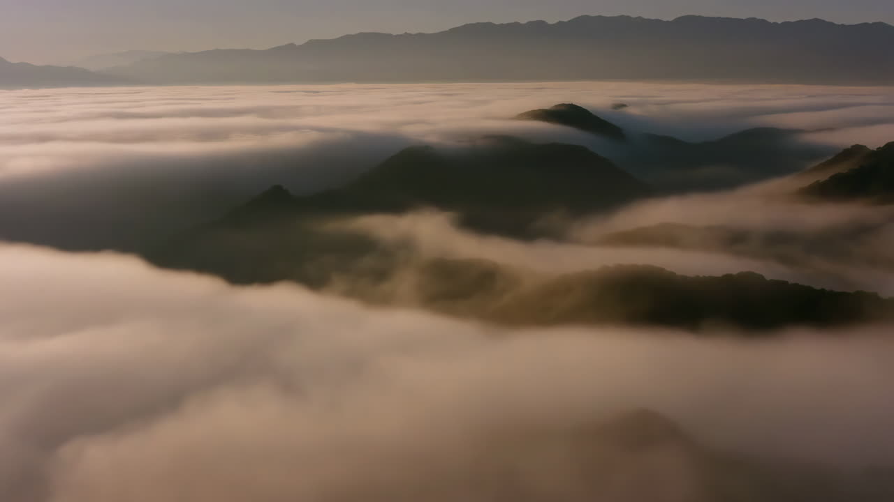 Majestic Mountains Emerging from a Sea of Clouds