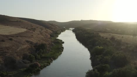 bird fly over a beautiful river in morocco on a beautiful sunset