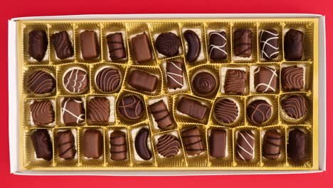various chocolates disappear from the box - stop motion