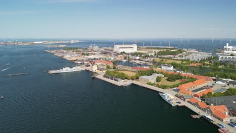 aerial pan of nyholm military harbor and industrial park, copenhagen, denmark