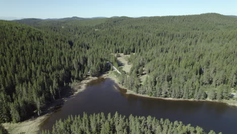 mountain lake with a road passing by