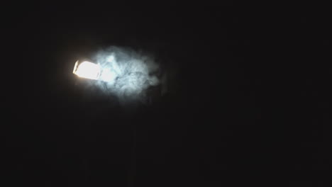 streetlight at night with smoke