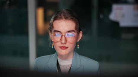 Professional woman wearing glasses in office