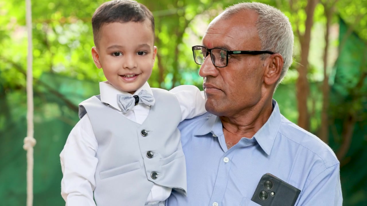 Heartwarming Grandfather And Grandson Bond During Outdoor Family Celebration Portrait