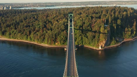 drone perspective view of the lions gate bridge - aerial shot during sunset