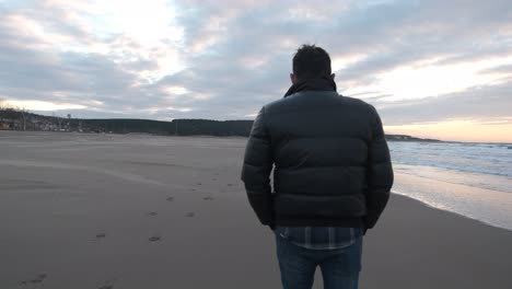 man walking in the sea
