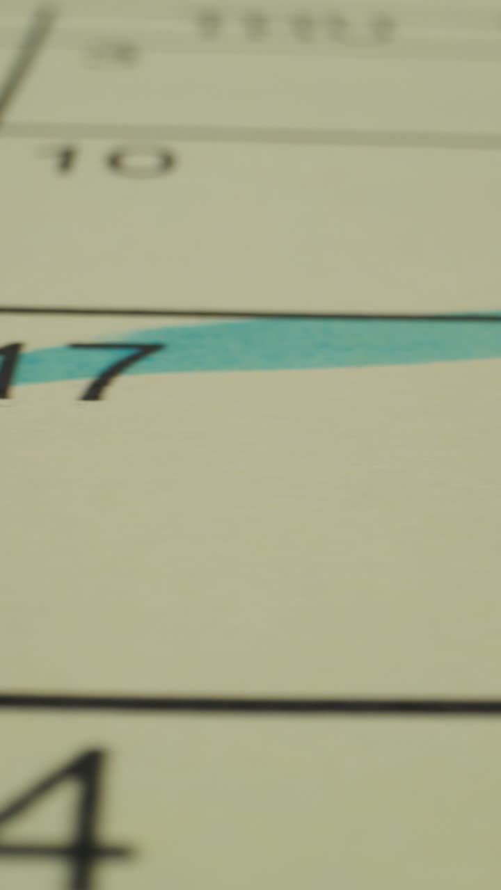 Close-up of a calendar page with highlighted date