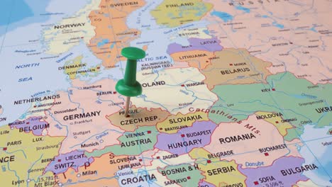 czech republic - travel concept with green pushpin on the world map. the location point on the map points to prague, the capital of the czech republic.