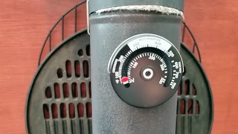 magnetic temperature gauge attached to antique cast iron stove chimney