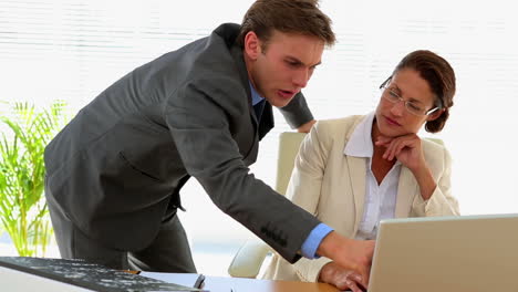 business people talking together at desk