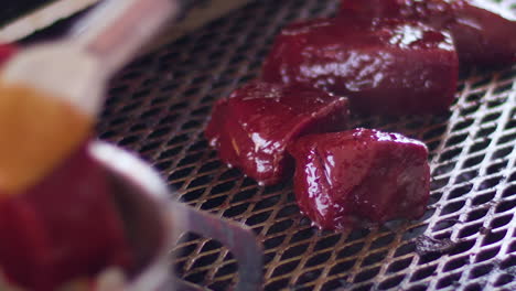 Putting-venison-on-a-grill-in-slow-motion