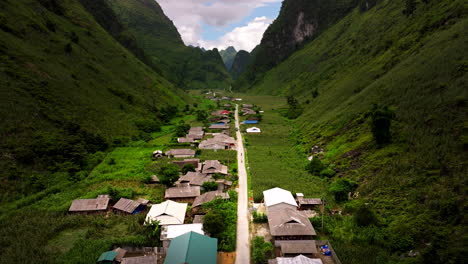 traditional homes in remote village in lush valley, yen minh vietnam