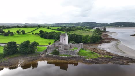 beautiful aerial reveal of doe castle building in donegal, ireland. moody afternoon