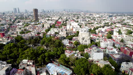 frontal drone shot of main church at south mexico city