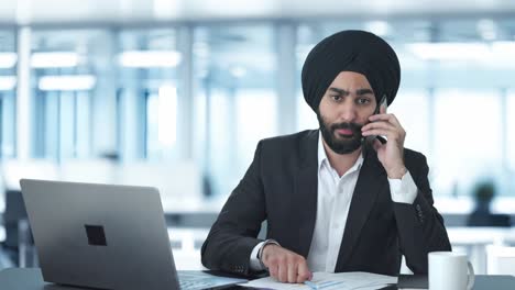 angry sikh indian businessman shouting on call
