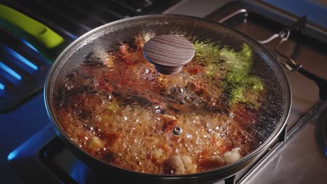 chicken noodles with vegetables and sauce simmering in the pan