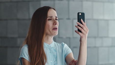 serious businesswoman having video chat