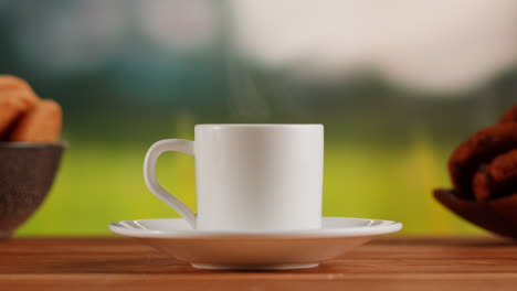 steaming coffee cup on a wooden table with blurred background