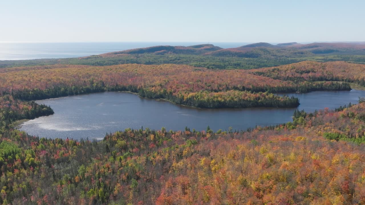 Cinematic Aerial Pan of Lake Agnes in Lutsen Minnesota During Peak Fall Foliage