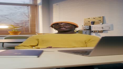 young man working on laptop in office