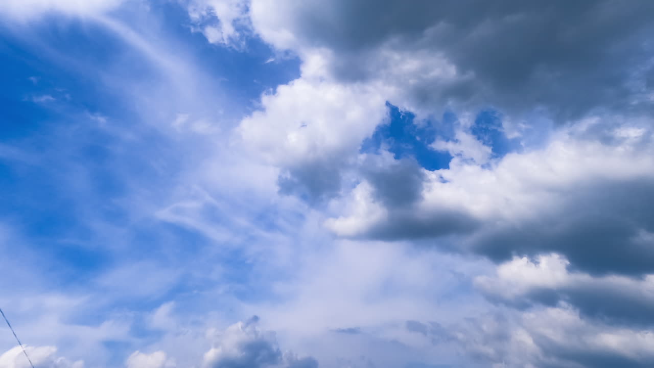 Flowing clouds in the sky. Blue summer rime lapse cloudscape.
