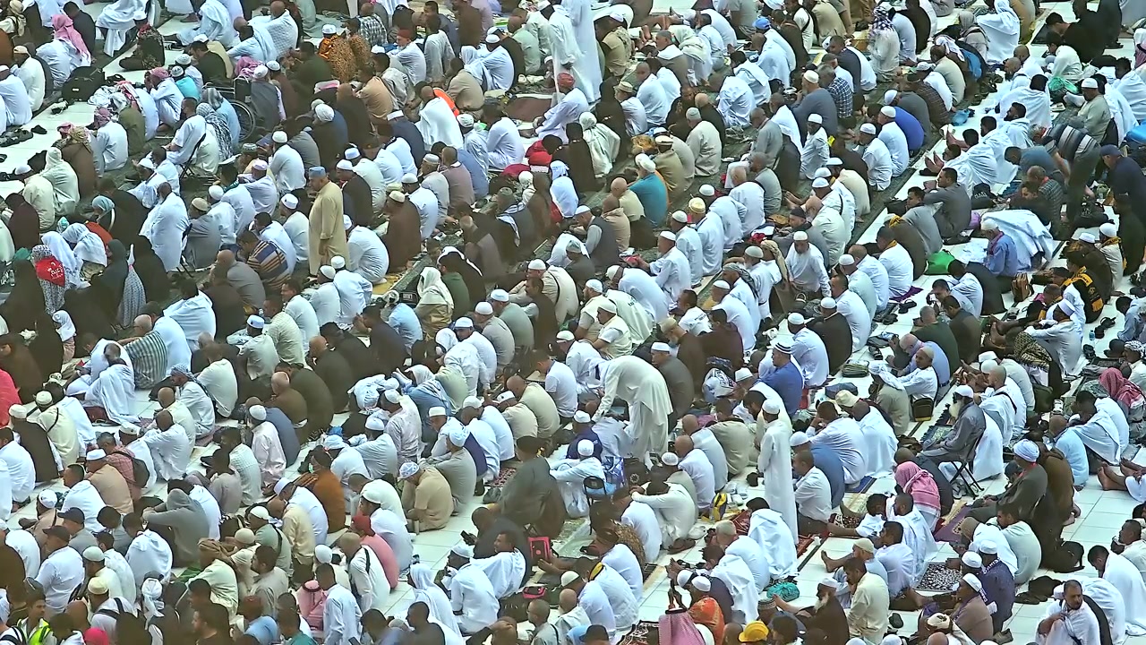 Large Group of Men Praying in Congregation
