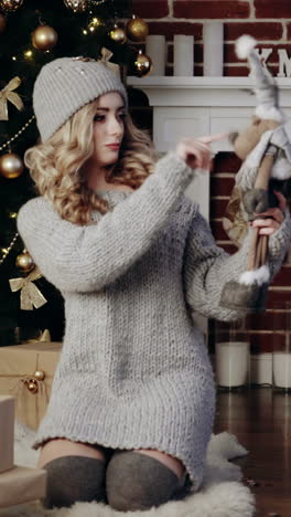 christmas holidays atmosphere. young woman waiting for christmas miracle in festive atmosphere vertical video