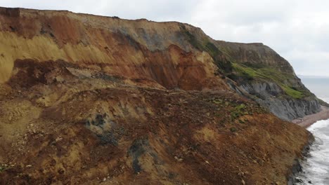 aerial view along large coastal landslip at seatown beach