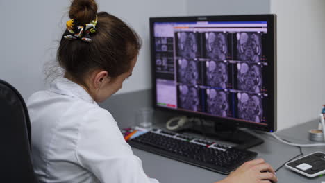 doctor reviewing medical images on computer