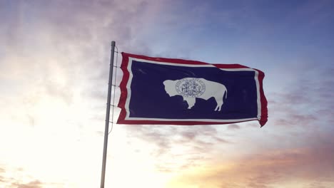 state flag of wyoming waving in the wind. dramatic sky background. 4k