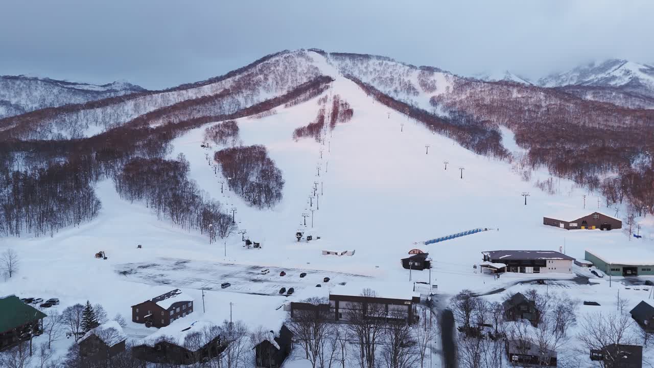 Panning shot of a rural back country ski slope in Hokkaido, Japan.