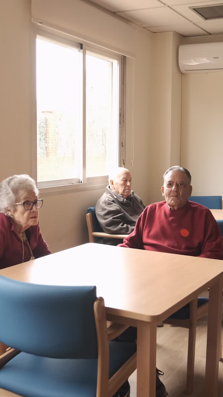 Old people gathering in lounge of retirement home