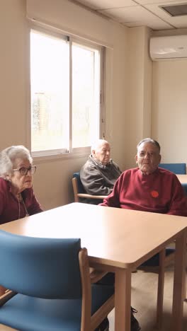 old people gathering in lounge of retirement home