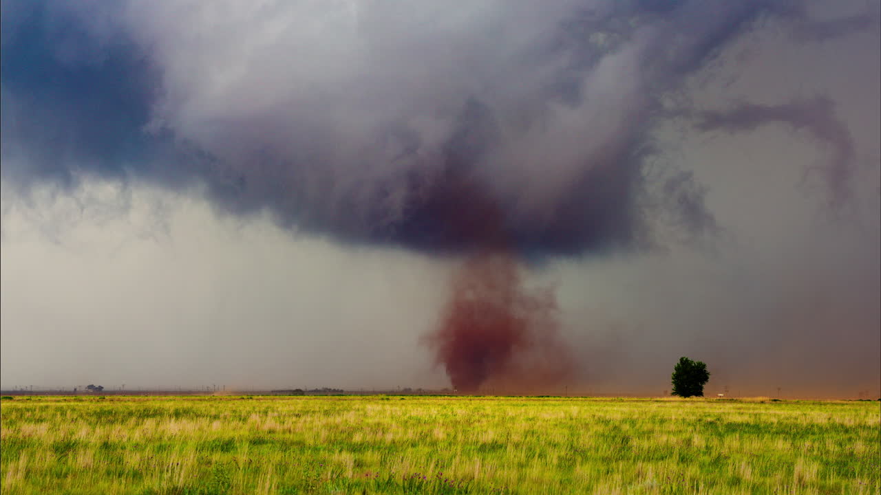 Intense Tornado Funnel Cloud Moving Across Rural Countryside
