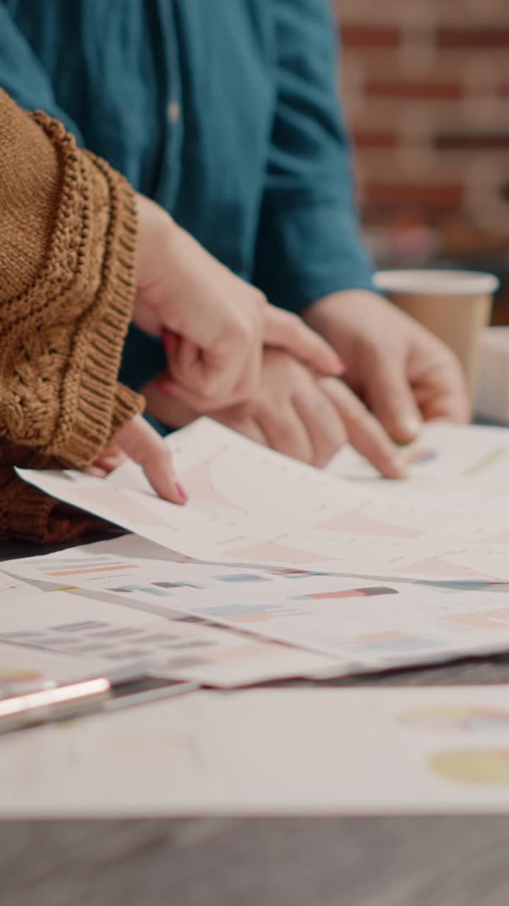 Business people working on graphs and charts