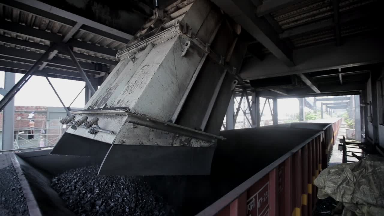 coal factory duping industrial raw material on train  full wide shot