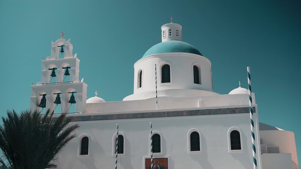 A small orthodox chappel in white and blue in a Greek Island during summer