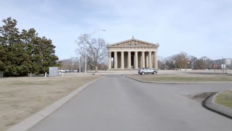 parthenon building in nashville, tennessee with drone video moving low sideways