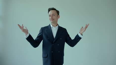 wide-shot-of-happy-confident-young-business-man,-employer-in-suit-turning-around,-hands-gesture-in-the-air